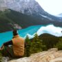 Top 10 views and scenic stops in the US man-sitting-near-lake-3572740
